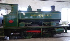 Restored green steam engine on display in industrial centre